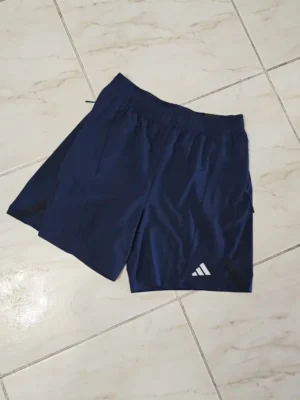 SHORT ADIDAS AZUL DE HOMBRE SHT59